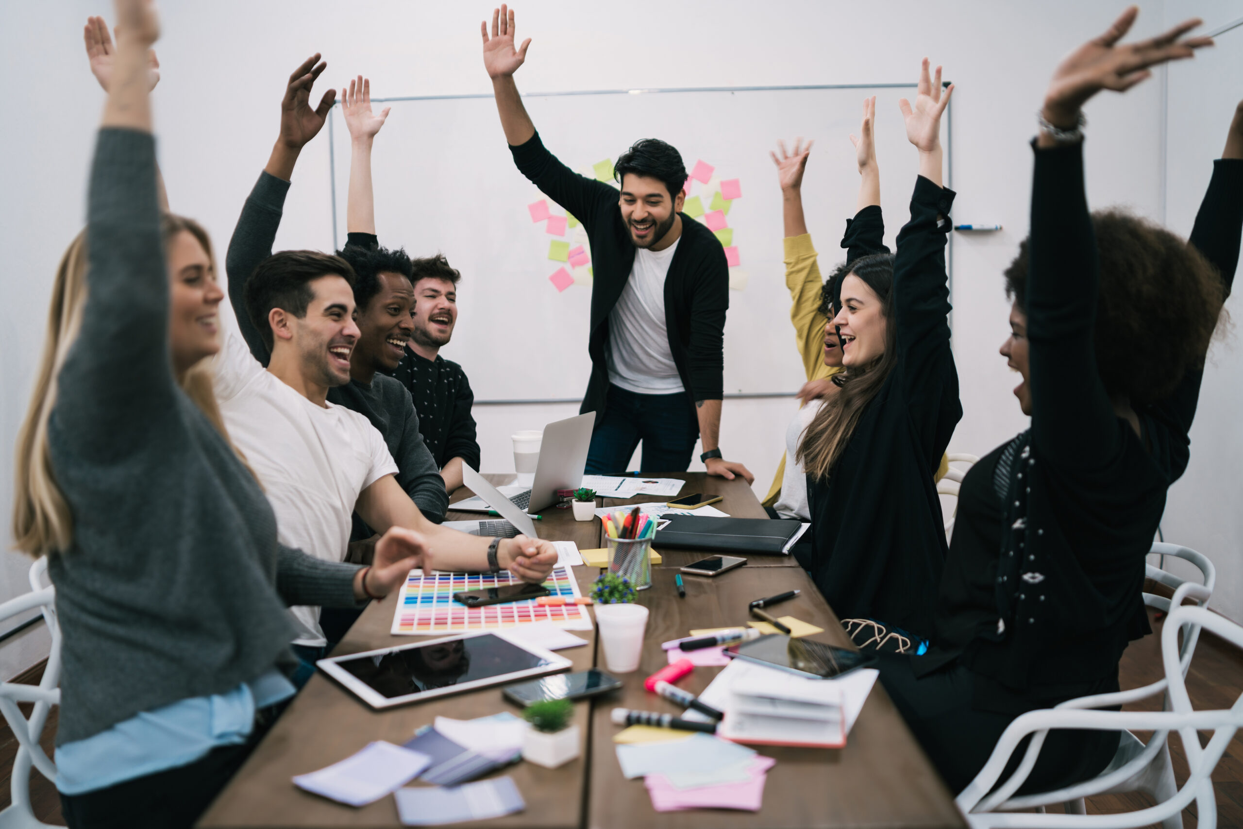happy business team celebrating with raised up hands office success winning concept scaled